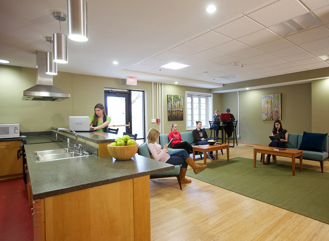 A new entry lounge connects the front door of the building with a warm, welcoming, and open set of spaces – including a new kitchen, recreation lounge, and game room. Together, these spaces create comfortable places for students to hang out for a variety of activities.